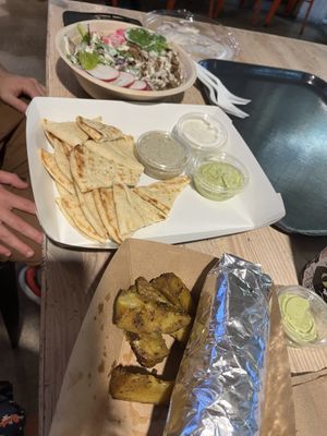 Chicken shawerma bowl, bread and dip mezza (with baba ganoush, tzatziki, and avocado lime), and the beyond kabob wrap    at Koshary Corner in Baltimore
