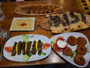 Grape leaves, falafel, hummus, bread, and pide (not vegan, but vegetarian options) at Rumist in Istanbul