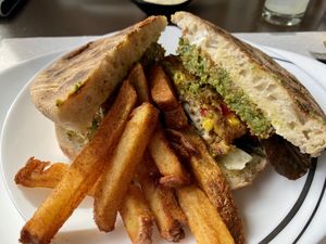 Vegan burger with seasoned fries.  at Bolo Do Caco Grill & Pizza in Sao Jorge