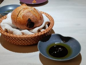 Rye bread with a sweet umami oil at Curious Table in Taipei
