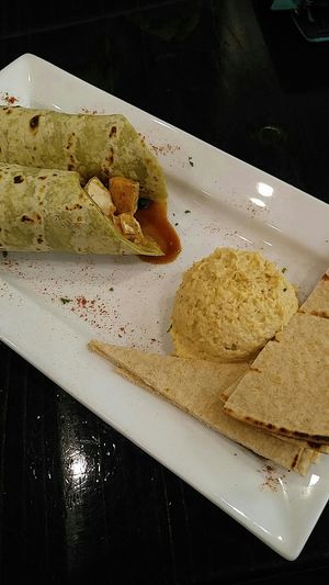 Thai wrap with tofu and a side of hummus. Best food I've had in Alabama. at Sunflower Cafe in Mobile