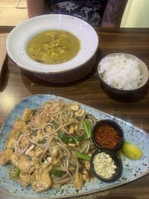 Yellow tofu curry (background) and Tofu Pad Thai (foreground)  at Asian Vegan Kitchen in Istanbul