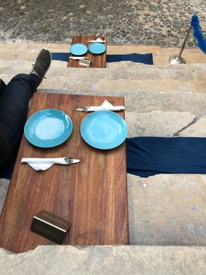 Sitting on the steps  at The Food Temple in Lisbon