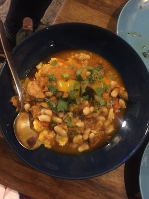 Polenta with coriander and vegetables in a pepper stew with vegan chorizo 😍 at The Food Temple in Lisbon