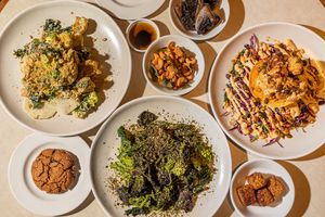 Palm Greens spread at Arcade Food Hall.  
Mains, sides and snacks! at Palm Greens & Soul in East London
