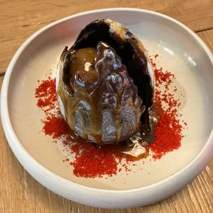 Huevo dracarys de chocolate con interior de helado y bizcocho  at Wild Food in Barcelona