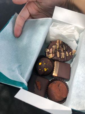 Four truffles plus a pistachio chocolate cup  at Kakawa Chocolate House in Santa Fe