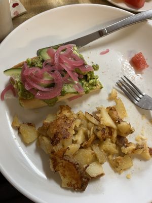 Avacado toast with home fries  at The Corner Restaurant in Milford