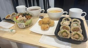 Maki sushi combo with Barley miso soup (right) and Chirashi-Sushi & Maki-Sushi combo with Hatcho miso soup (left). Chickpea croquette in the middle  at Brown Rice Sushi TEC 玄米のおすしテック in Osaka