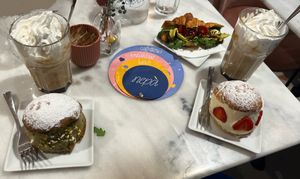 Caramel lattes, Maritozzo with pistachio and with strawberries+chantilly, savoury croissant   at Nepá in Milan