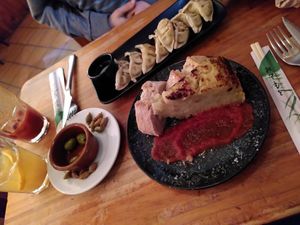 Gyoza and tortilla, with delicious Linda pear juice at Viva Chapata in Madrid