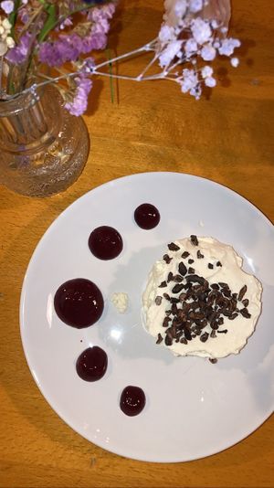 Dessert august 2023: tonka mousse. A fluffy and light mousse with tonka flavor. Very tasty, the fruit sauce on the side balanced it perfectly  at Tonka in Frankfurt