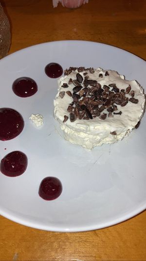 Dessert august 2023: tonka mousse. A fluffy and light mousse with tonka flavor. Very tasty, the fruit sauce on the side balanced it perfectly  at Tonka in Frankfurt