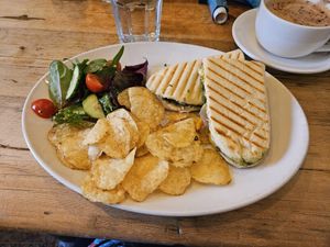 Vegan roast veg, pesto and vegan cheeze panini served with crisps and side salad at Nosh in Pickering