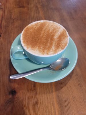 Chai Latte (Made with Oat Milk and Sprinkled with Cinnamon) at The Wild Oak Cafe in Llanidloes