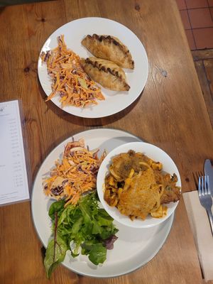 Bean & Feta Empanadas with Coleslaw Salad and Baked Tofu Curry with Onion Bhajis with Coleslaw and Mixed Leaf Salad at The Wild Oak Cafe in Llanidloes