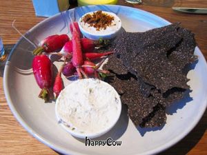 Rye crisps with radishes and dips topped with coconut bacon at M.A.K.E. Raw Cuisine in Santa Monica