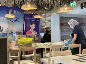 Staff preparing in flight meals for Thai Airways  at HKT - Thai Catering in Phuket