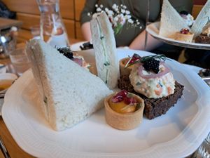 Afternoon tea: cucumber sandwich, carrot lox with rye bread and pumpkin tartelette at Ateneum Bistro in Helsinki