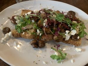 Mushrooms and hummus on toast with vegan feta   at Hemingways of Haslemere in Haslemere