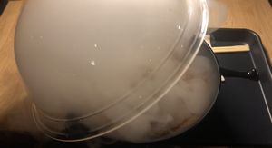 So exciting!  Removing the clear bowl holding the hardwood smoke inside   at REDWHITE BONELESS RAMEN - Studio City in Studio City