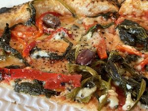 Calzone (stuffed with vegan mozzarella, deep-fried aubergines and mushrooms) and vegan margherita topped with friarielli, black olives and bell peppers   at Sacro Dough Pizza in North West London