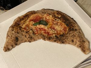 🍆🍕NEAPOLITAN CALZONE STUFFED WITH VEGAN MOZZARELLA, DEEP-FRIED AUBERGINES, SAUTÉED MUSHROOMS AND DEEP-FRIED COURGETTES 🍄🥒  at Sacro Dough Pizza in North West London