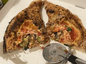 🍆🍕NEAPOLITAN CALZONE STUFFED WITH VEGAN MOZZARELLA, DEEP-FRIED AUBERGINES, SAUTÉED MUSHROOMS AND DEEP-FRIED COURGETTES 🍄🥒  at Sacro Dough Pizza in North West London