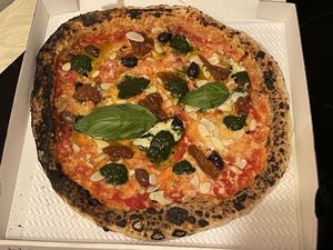 🌱🧀🍕 NEAPOLITAN PIZZA - VEGAN MARGHERITA WITH SUN-DRIED TOMATOES, ALMOND FLAKES, BLACK OLIVES AND PESTO 🥜🍅🫒  at Sacro Dough Pizza in North West London