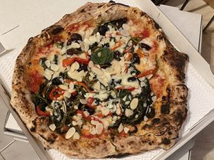 Vegan margherita with friarielli, black olives, roasted peppers and almond flakes  at Sacro Dough Pizza in North West London