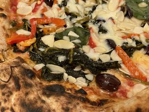 Vegan margherita with friarielli, black olives, roasted peppers and almond flakes  at Sacro Dough Pizza in North West London