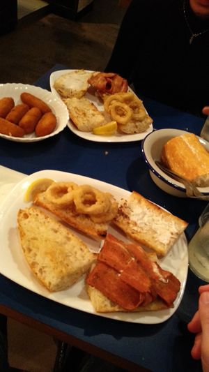 En la foro: un montadito de calamares, otro de bacon, y una ración de croquetas de calabaza at B13 Bar in Madrid