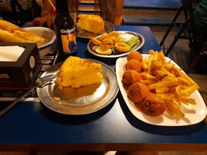 Tortilla de patata, calamares fritos y albóndigas con patatas fritas.  at B13 Bar in Madrid