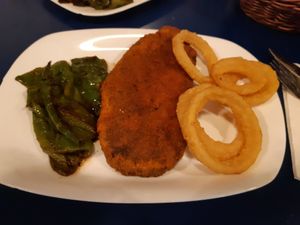 Combo plate: seitan schnitzel, fried green peppers and onion rings at B13 Bar in Madrid