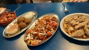 Croquetas,  falafel, salchipapas y pollo al ajillo at B13 Bar in Madrid