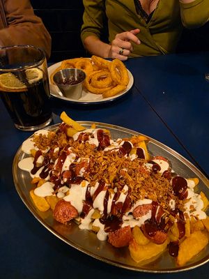 Salchipapas and onion rings at B13 Bar in Madrid