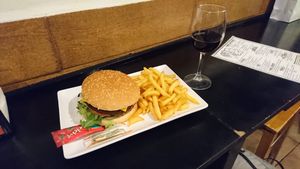 Hamburger, french fries and red wine - Rioja crianza - in great place at B13 Bar in Madrid