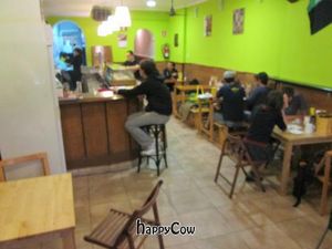 Inside of restaurant -- ultra casual with a bar and tables at B13 Bar in Madrid