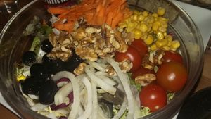 Salad with fresh vegetables and walnuts at B13 Bar in Madrid