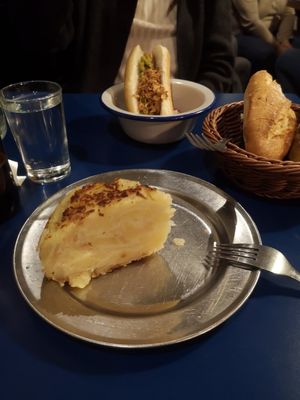 Delicious tortilla and hot dog at the back at B13 Bar in Madrid