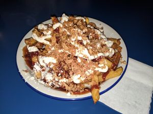 salchipapas (fries, salusage, mayonnaise and ketchup) at B13 Bar in Madrid