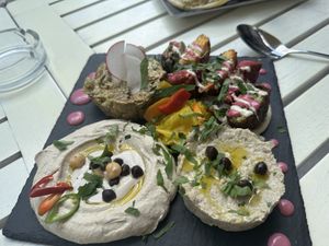 Vegan platter for 4: hoummus, falafel, babaganoush, eggplant tartar  at Aubergine - Aviatorilor in Bucharest