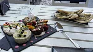 Vegan platter for 4: hoummus, falafel, babaganoush, eggplant tartar & za’atar pita  at Aubergine - Aviatorilor in Bucharest