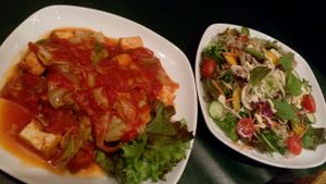 Salad and Fried tofu w/ cabbage and tomato starters at Olu Olu Cafe in Tokyo
