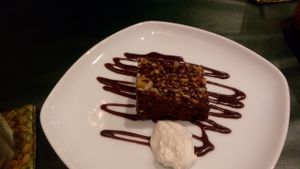 Brownie with whipped cream at Olu Olu Cafe in Tokyo