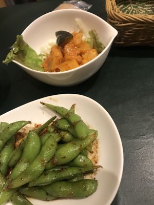 Their signature edamame plus a special side order (coconut milk potato) at Olu Olu Cafe in Tokyo