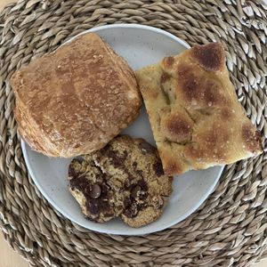 Cookie, focaccia and pan au chocolate   at  Flo Specialty Coffee & bakery in Utrecht