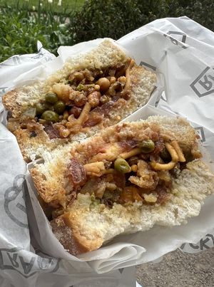 Samosa Chaat Vegan Sandwich 🌱 White Bloomer with Smashed Samosa, Tamarind Chutney, Tomato, Green Chilli Sauce, Bombay Mix (Bought to take away)  at Rack in Stockport