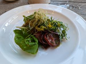 Farm leeks with black Iberico tomatoes and crispy leeks at Marle in Hook