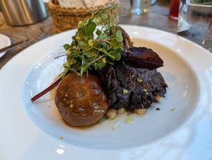 Roasted oyster mushrooms with confit tomato. Wild garlic and white beans. at Marle in Hook